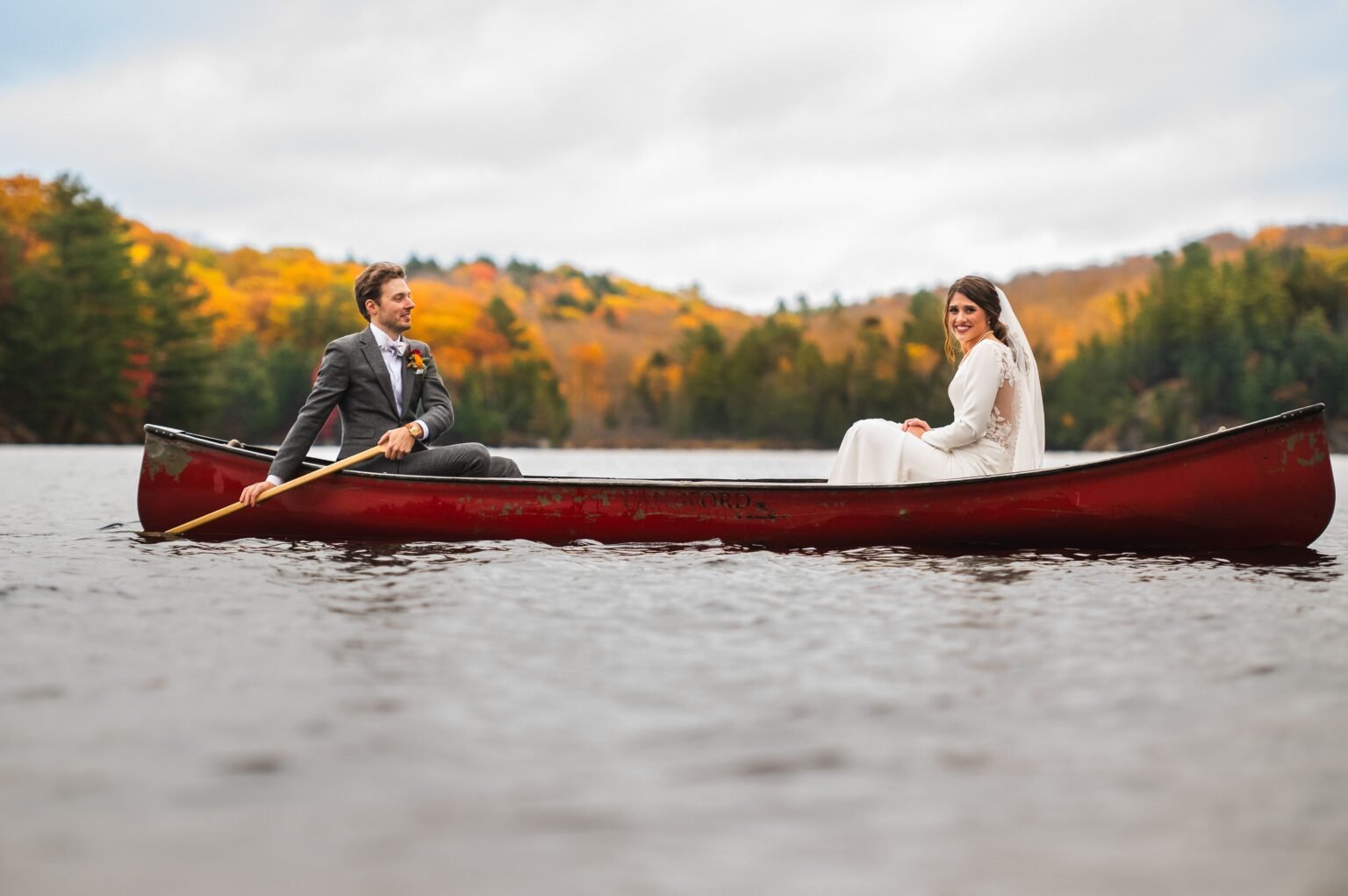 Muskoka lake view with vibrant autumn colours, showcasing the perfect seasonal backdrop for chauffeur tours
